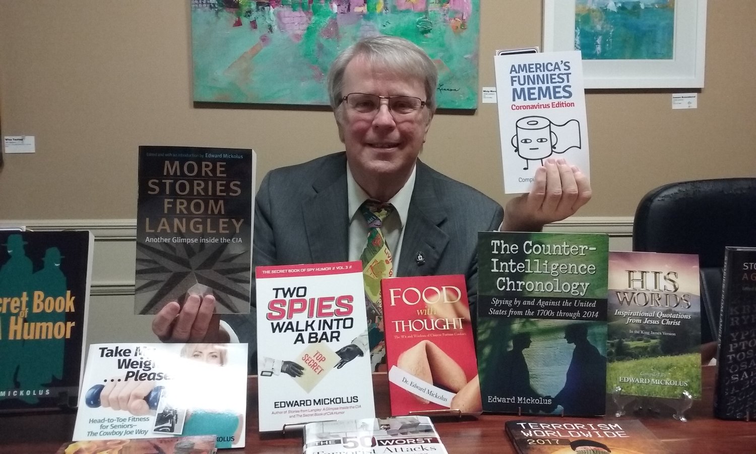 Local author Ed Mickolus is seen with some of his more-than-40 books.